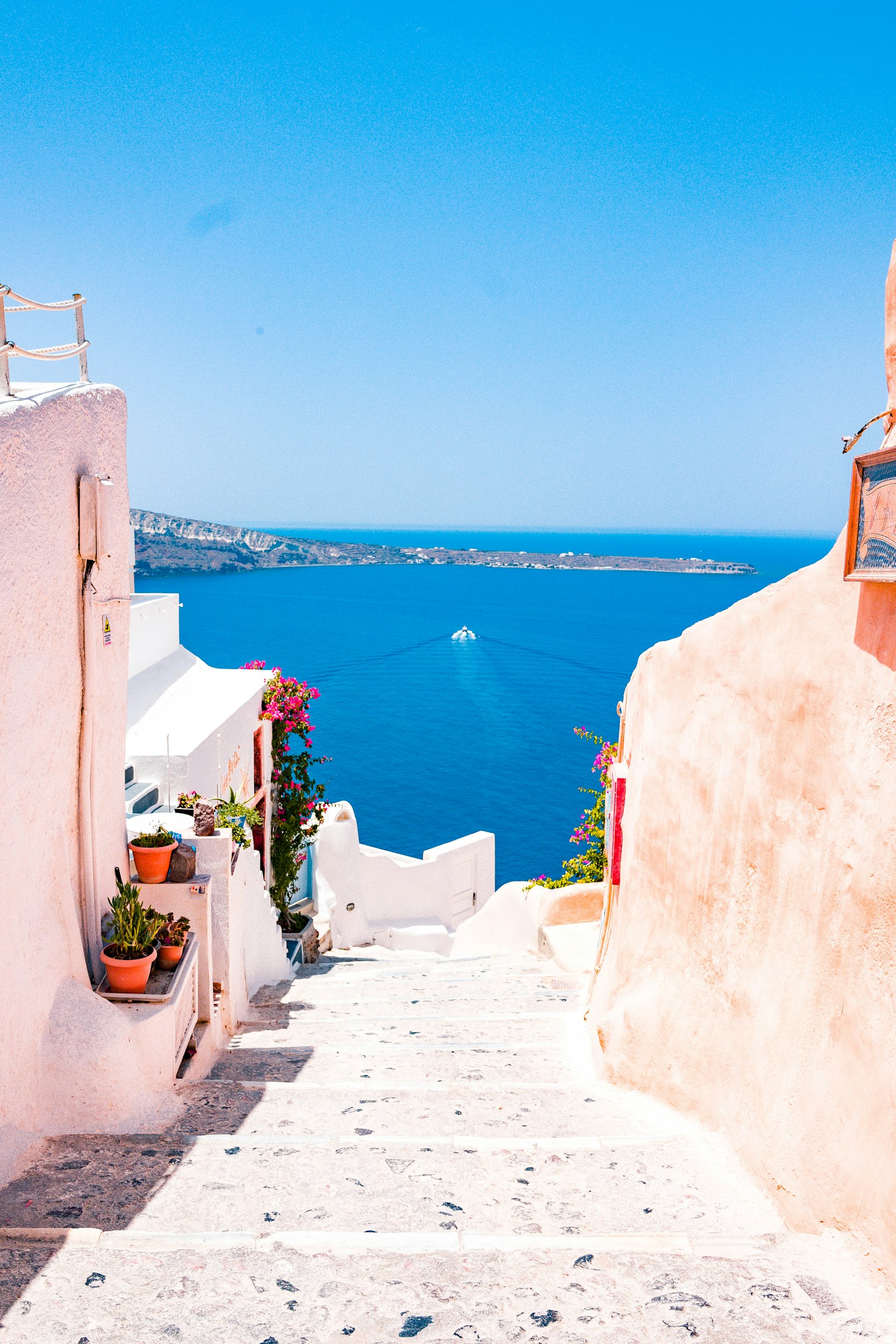 Whitewashed cliffside village above sapphire water